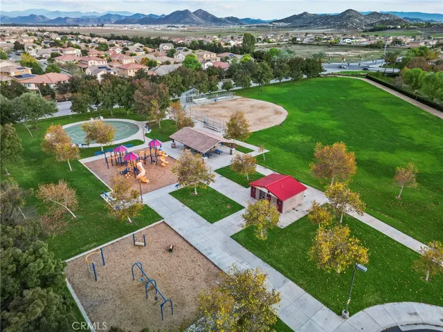 an aerial view of a house with a yard