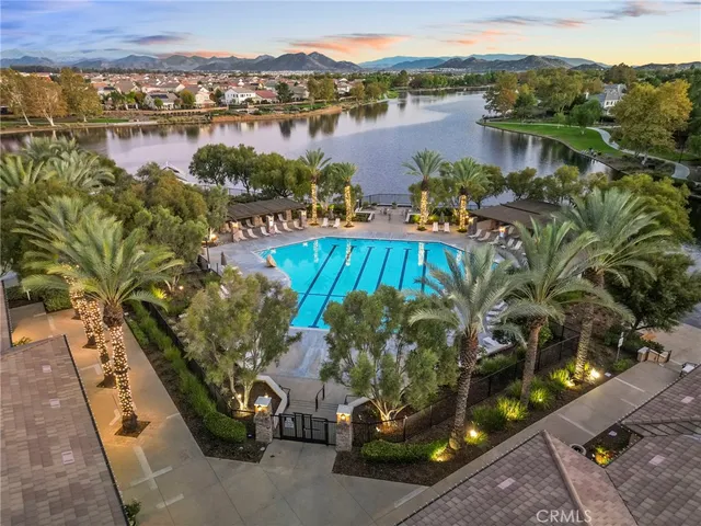 an aerial view of residential house with outdoor space and lake view