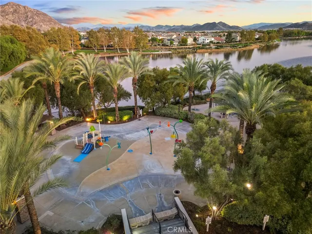 a view of a patio with table and chairs under an umbrella