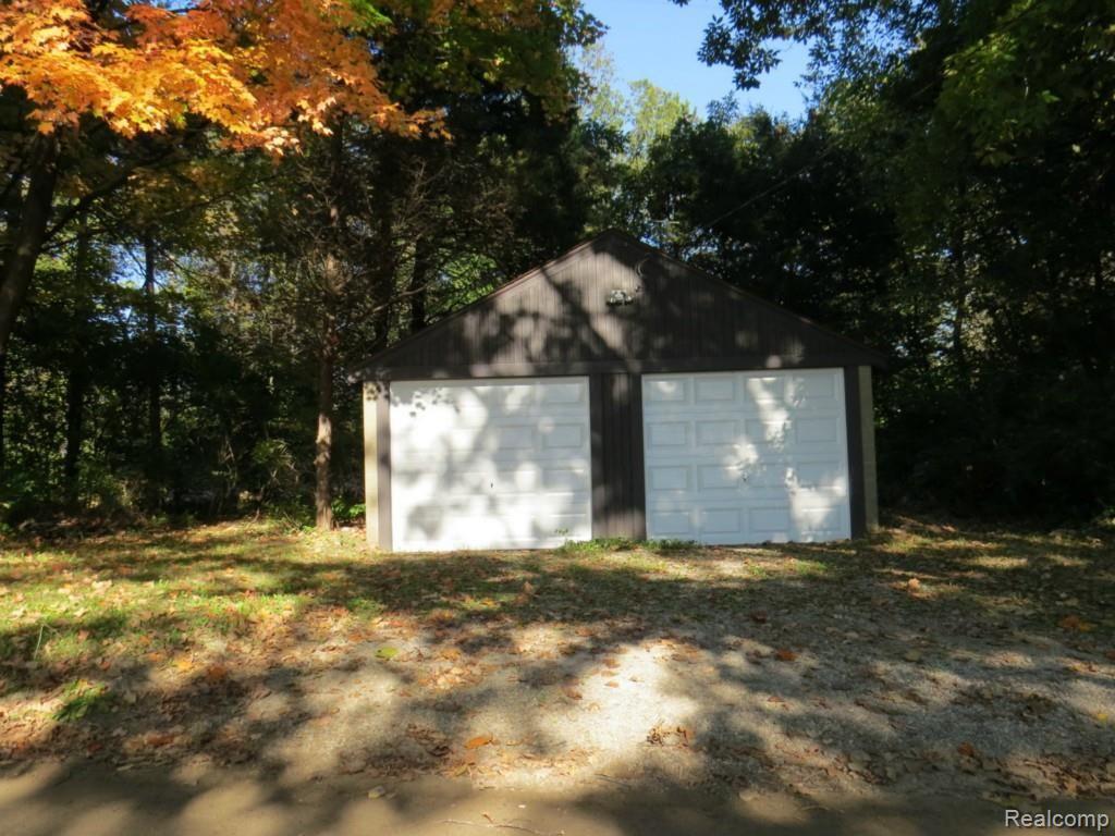 11208 Hall Road Whitmore Lake, MI 48189 - Photo 28 of 30 Garage view, brand new doors and overhead the signs of autumn season coming