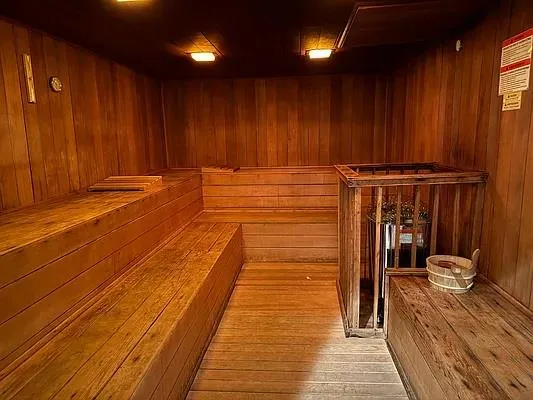 a view of a gallery with wooden floor