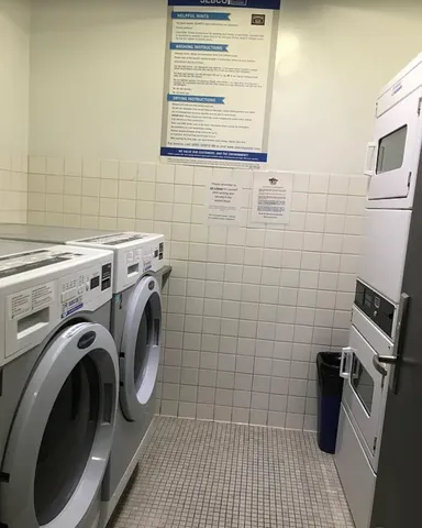 a bathroom with a sink and a washer dryer