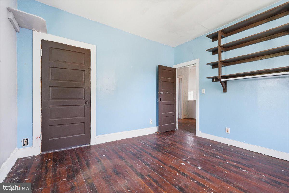 73 Church Road Arnold, MD 21012 - Photo 20 of 29 an empty room with wooden floor closet and windows