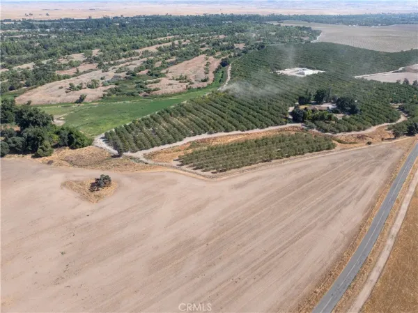an aerial view of a house with yard