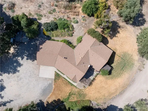 an aerial view of house with yard