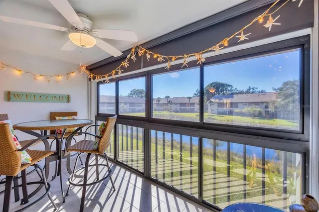 a view of a dining room with furniture window and outside view