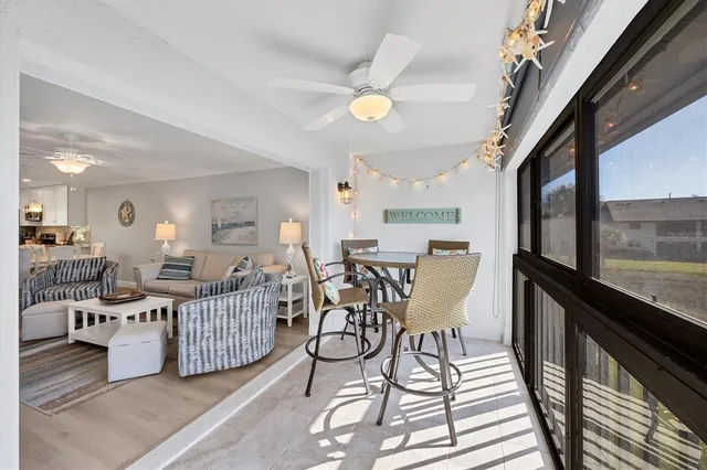 a living room with lots of furniture and white walls