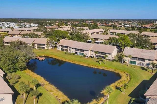 an aerial view of a house with a swimming pool