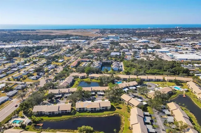 an aerial view of residential building and lake