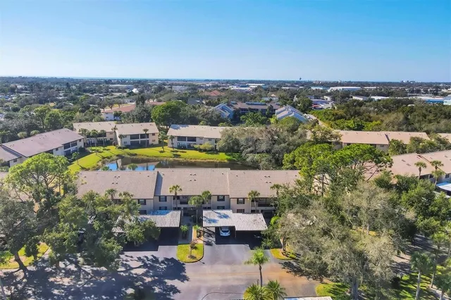 an aerial view of a house with a lake view