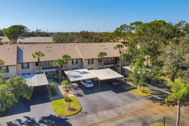 a view of a swimming pool with a patio and a yard