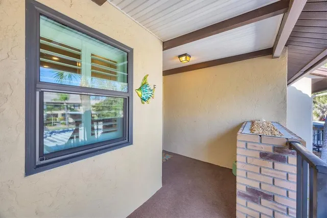 a view of room with window and hallway