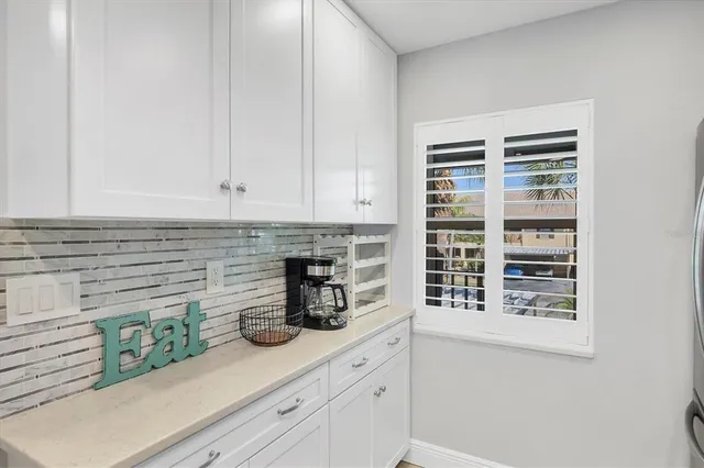 a kitchen with appliances and cabinets
