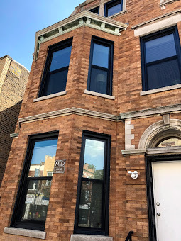 1739 West 18th Street, Unit 1F Chicago, IL 60608 - Photo 1 of 12 a front view of a building with parking space
