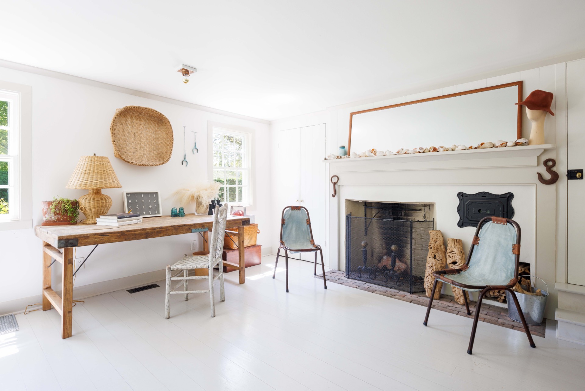 25825 Main Road Orient, NY 11957 - Photo 14 of 28 a living room with furniture a table and a fireplace