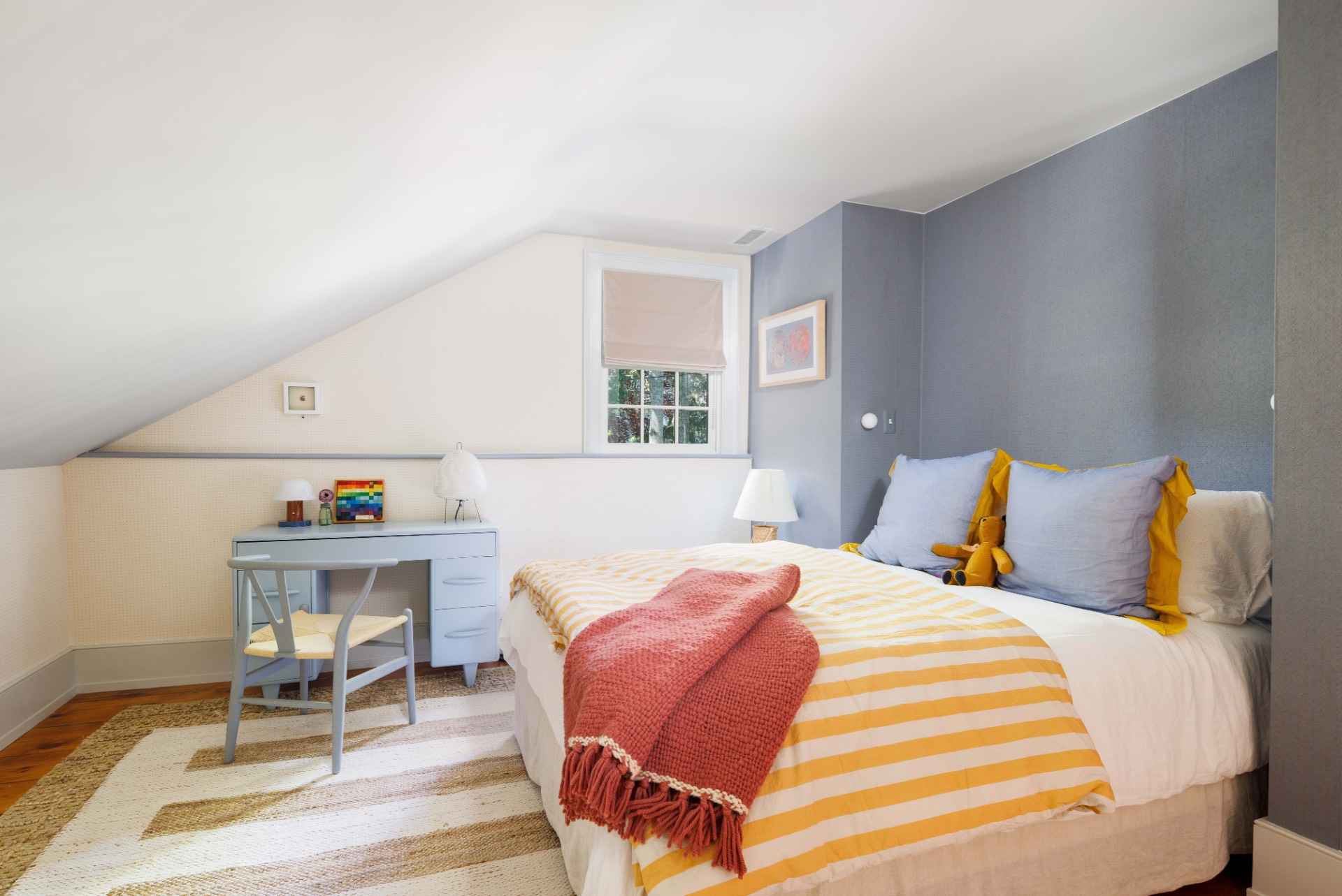 25825 Main Road Orient, NY 11957 - Photo 17 of 28 a bed sitting in a bedroom next to a window with chair and table