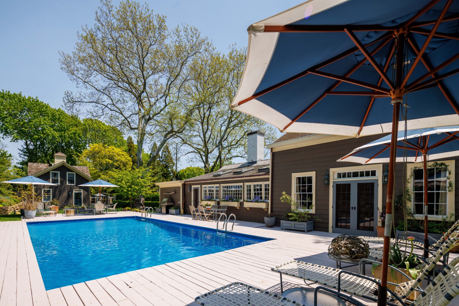 25825 Main Road Orient, NY 11957 - Photo 19 of 28 a view of a house with swimming pool and sitting area