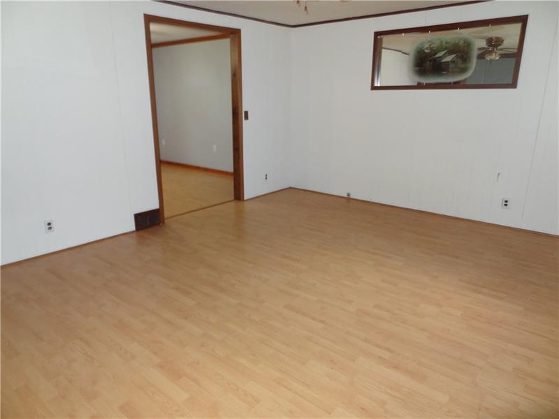 37 Lightcap Road Latrobe, PA 15650 - Photo 4 of 23 Living room leads into the dining area.