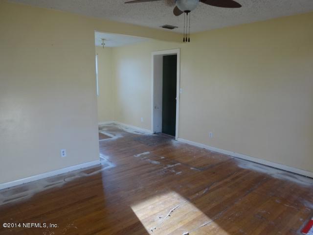 2608 Randy Road Jacksonville, FL 32216 - Photo 3 of 11 an empty room with wooden floor