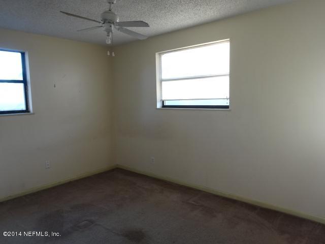 2608 Randy Road Jacksonville, FL 32216 - Photo 7 of 11 an empty room with a window
