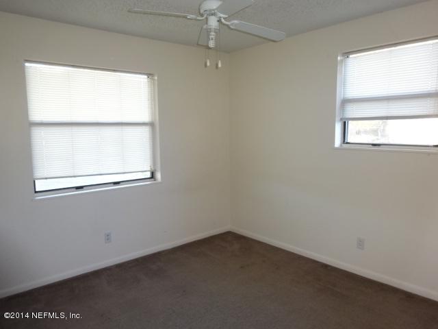 2608 Randy Road Jacksonville, FL 32216 - Photo 8 of 11 an empty room with a window