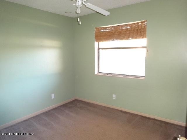 2608 Randy Road Jacksonville, FL 32216 - Photo 9 of 11 an empty room with a window