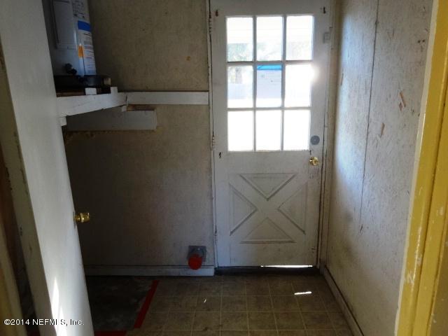 2608 Randy Road Jacksonville, FL 32216 - Photo 10 of 11 an empty room with wooden floor and windows