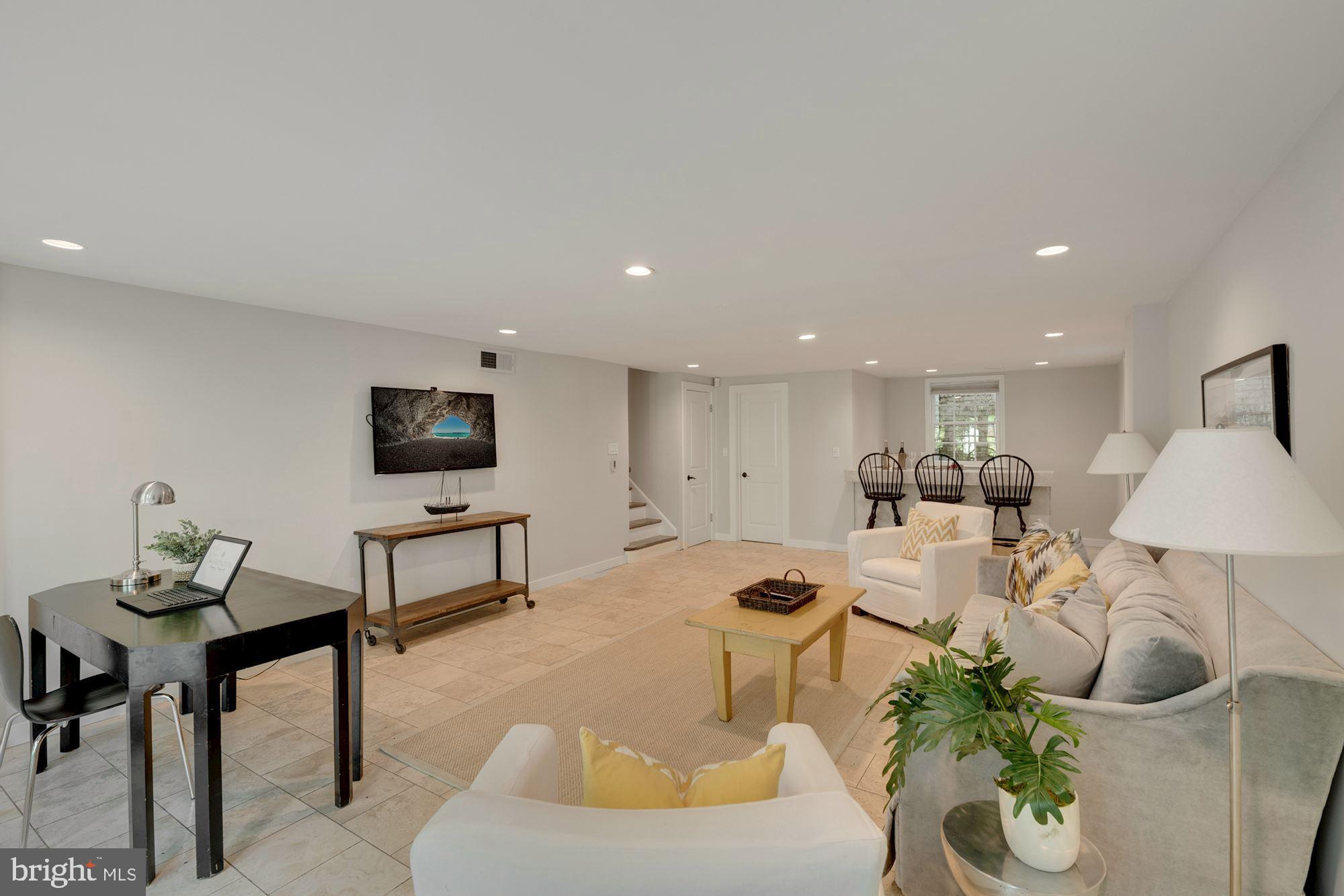 4480 Dexter Street Northwest Washington, DC 20007 - Photo 27 of 33 Family Room with Powder Room leads to Laundry.