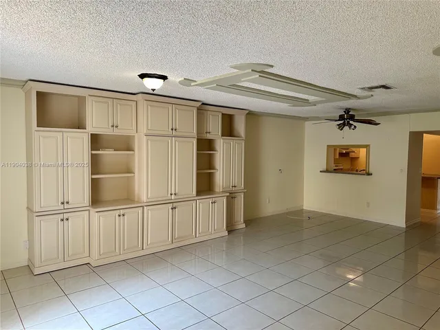 a view of hallway with a large window