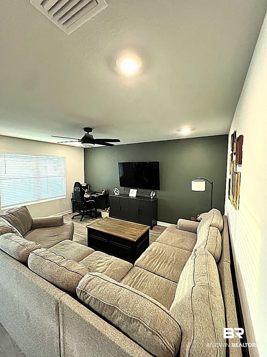 23915 Veranda Circle Elberta, AL 36530 - Photo 6 of 16 Living area with a desk and ceiling fan
