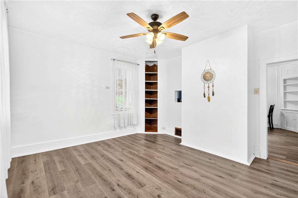 574 Webster Hollow Road Rostraver Township, PA 15012 - Photo 23 of 46 a view of kitchen with wooden floor and window