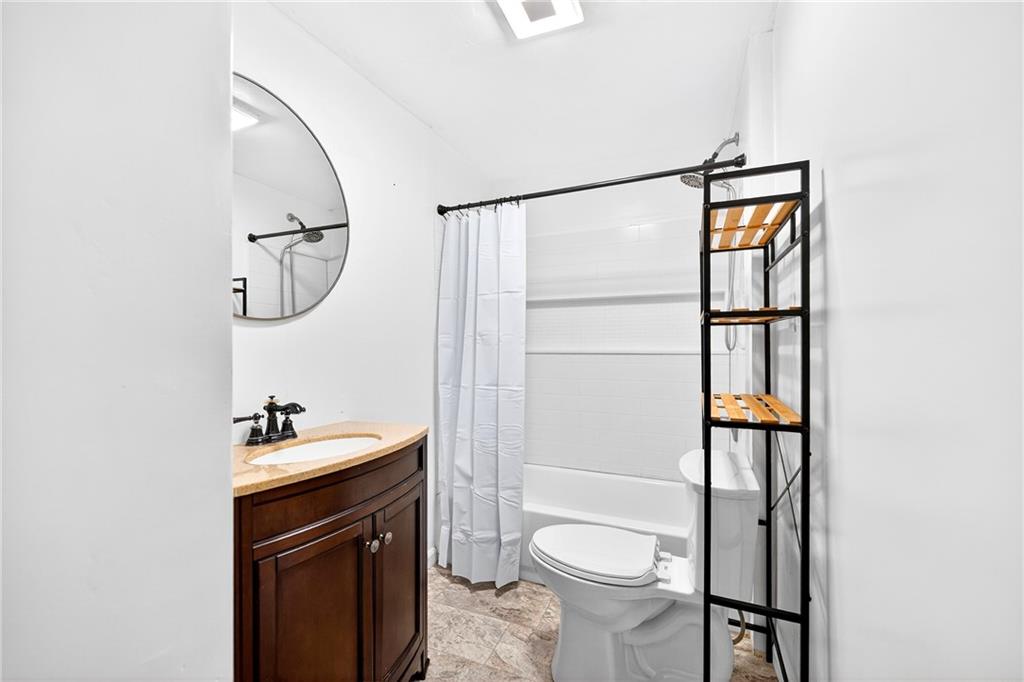 574 Webster Hollow Road Rostraver Township, PA 15012 - Photo 36 of 46 a bathroom with a sink a toilet and a mirror