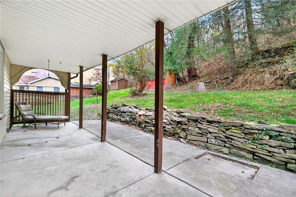 574 Webster Hollow Road Rostraver Township, PA 15012 - Photo 43 of 46 a view of a porch with a bench in the patio