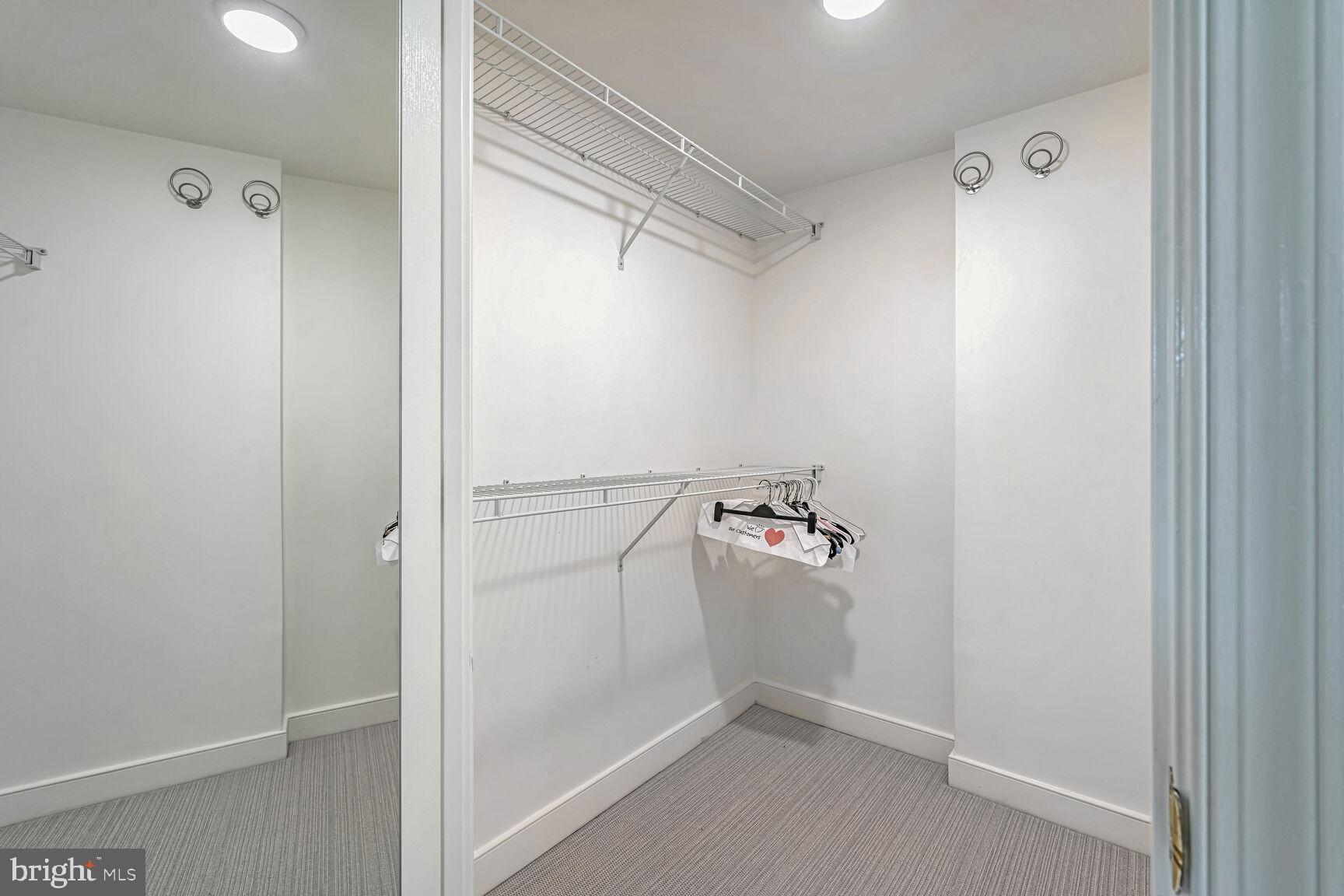 616 E Street Northwest, Unit 1150 Washington, DC 20004 - Photo 26 of 75 a view of walk in closet with empty racks