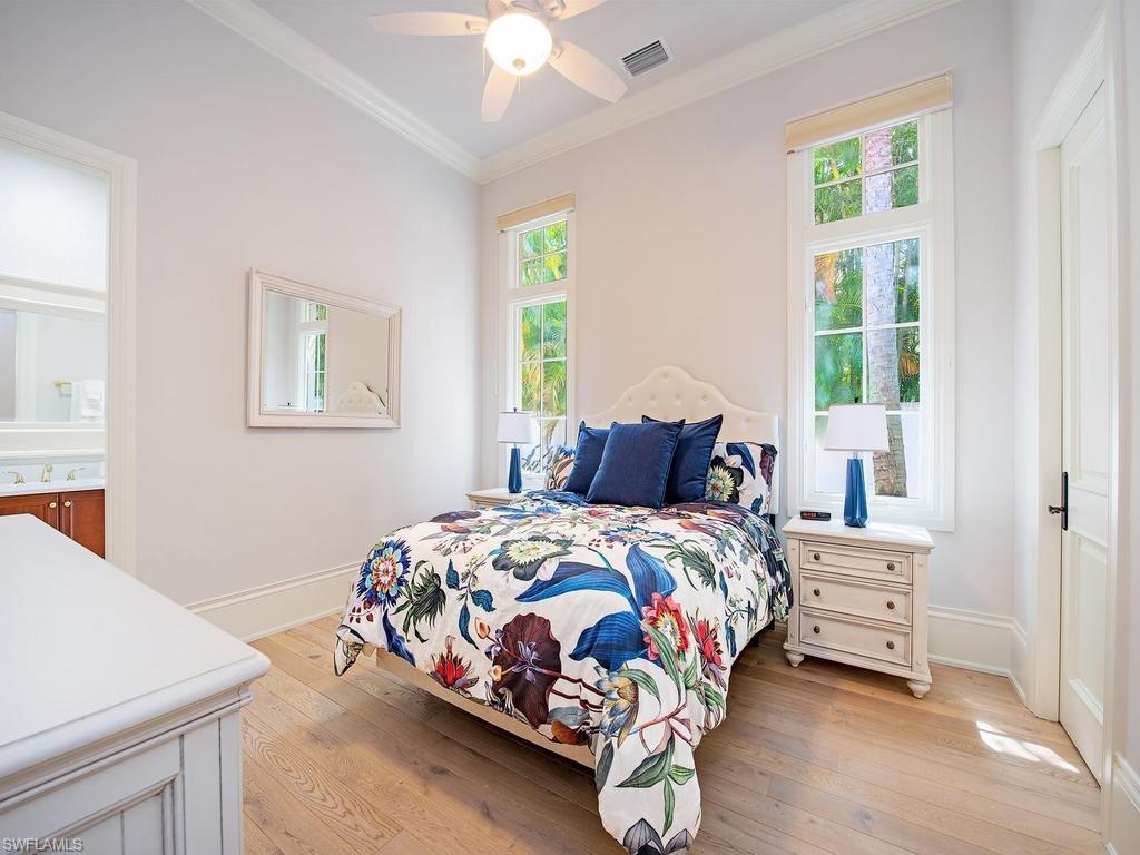 2202 Miramonte Way Naples, FL 34105 - Photo 19 of 23 a bedroom with a bed and a window