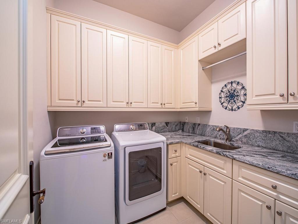 2202 Miramonte Way Naples, FL 34105 - Photo 22 of 23 a utility room with sink dryer and cabinets