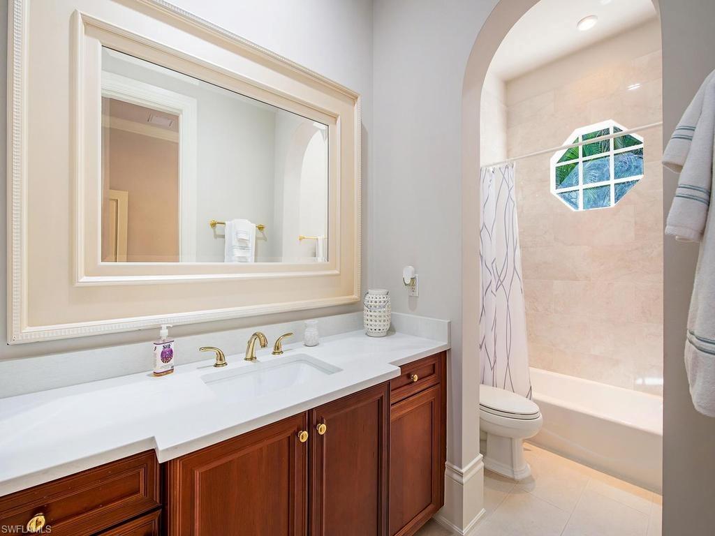 2202 Miramonte Way Naples, FL 34105 - Photo 23 of 23 a bathroom with a sink a toilet and shower