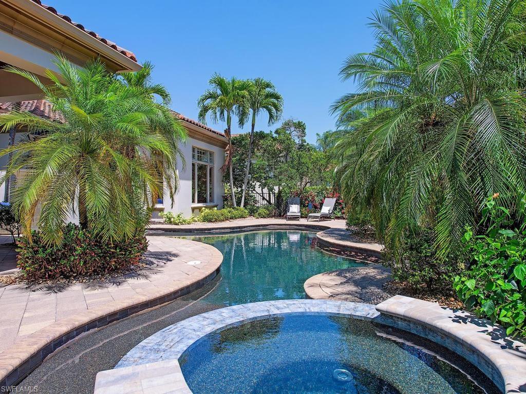 2202 Miramonte Way Naples, FL 34105 - Photo 3 of 23 a view of a backyard with plants and swimming pool