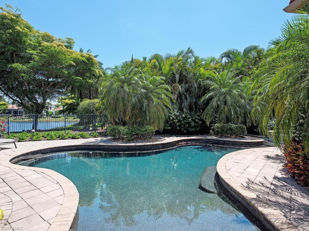 2202 Miramonte Way Naples, FL 34105 - Photo 5 of 23 a view of swimming pool with a yard