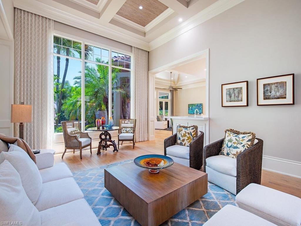 2202 Miramonte Way Naples, FL 34105 - Photo 6 of 23 a living room with furniture and floor to ceiling windows