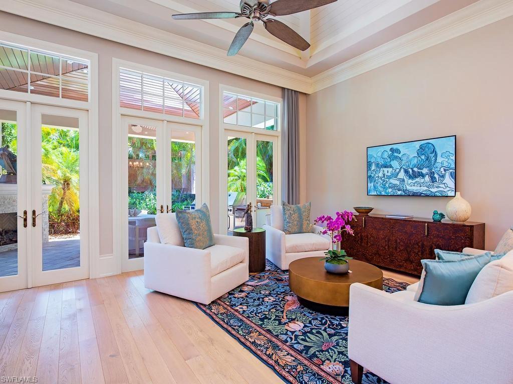 2202 Miramonte Way Naples, FL 34105 - Photo 9 of 23 a living room with furniture and a large window