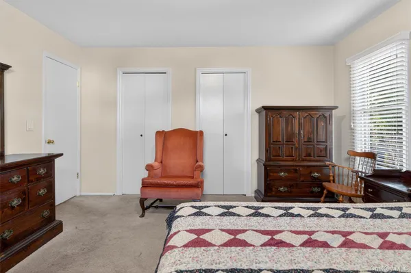 a bedroom with a bed and furniture