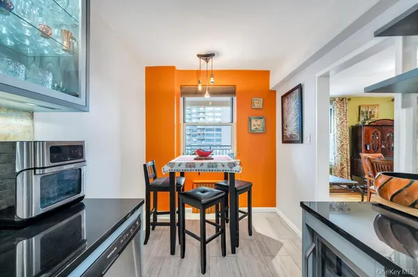a dining room with furniture and window