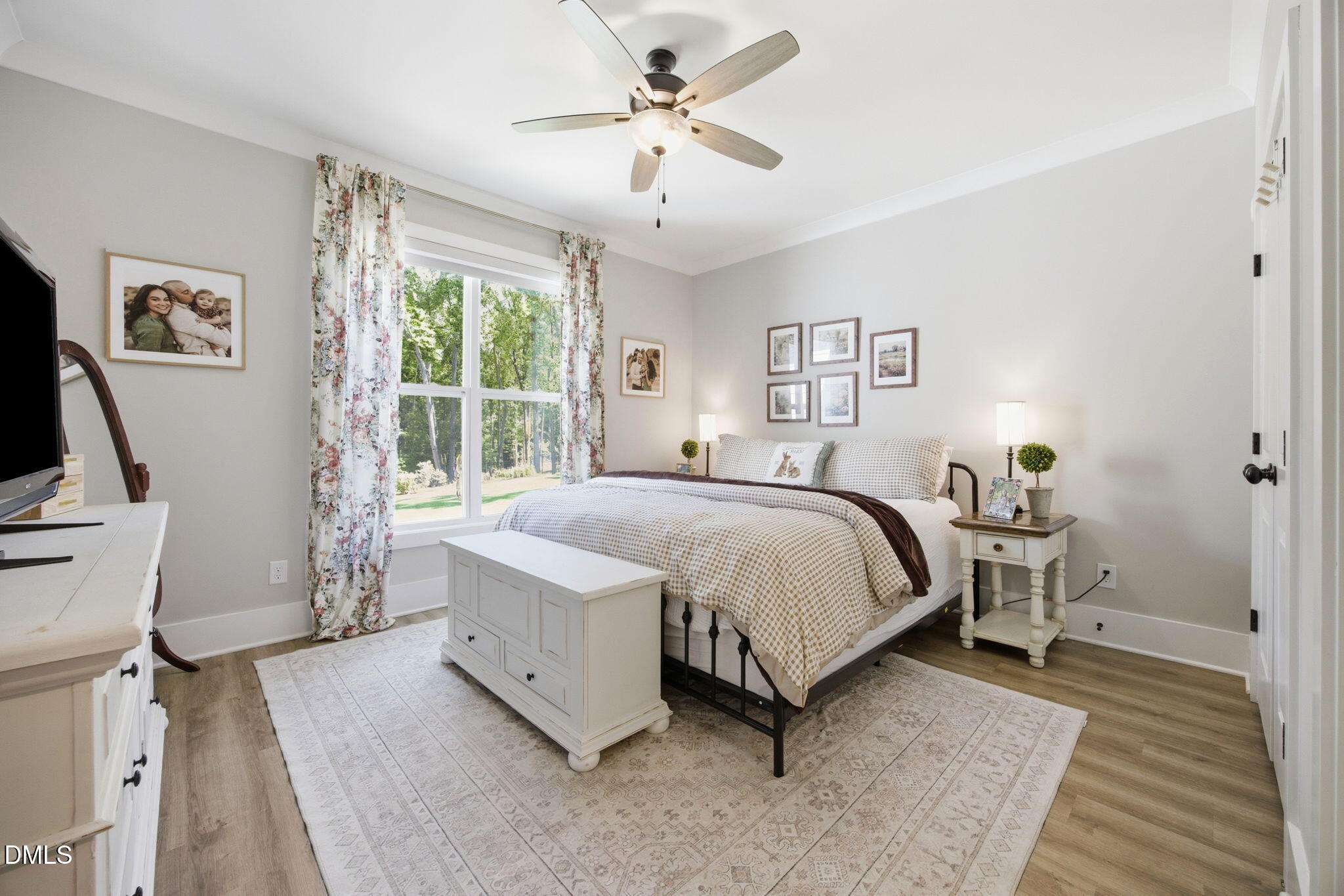 3511 Bruce Garner Road Wake Forest, NC 27587 - Photo 25 of 56 a bed room with a bed and a chandelier