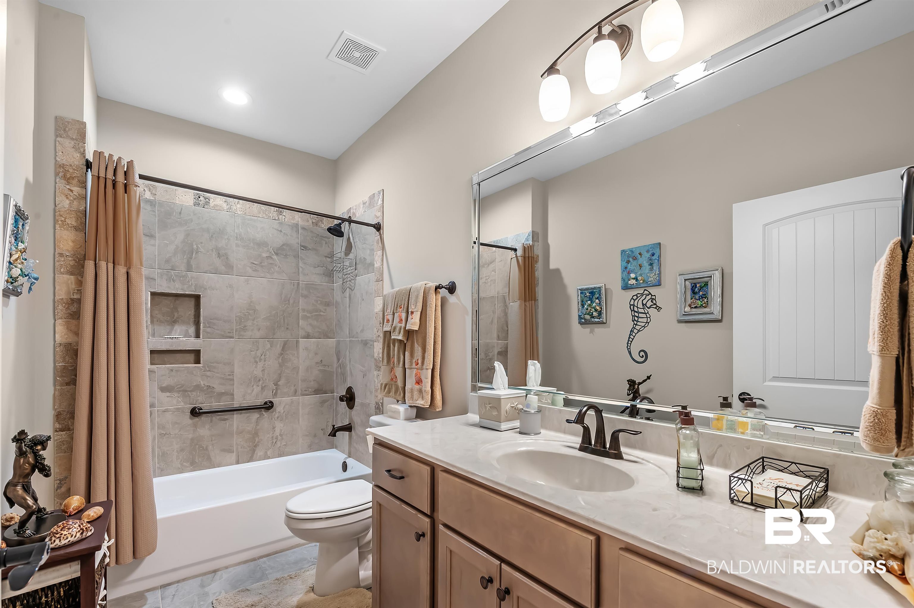 185 Mark Twain Loop Foley, AL 36535 - Photo 34 of 54 Full bathroom with shower / tub combo with curtain, vanity, and toilet