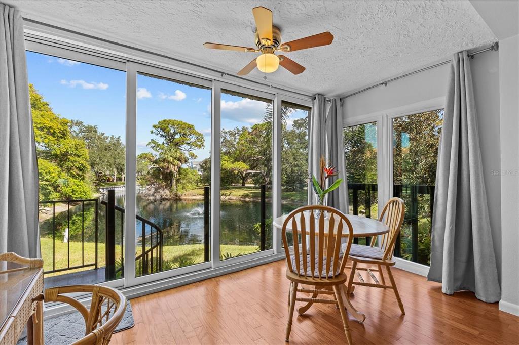 1800 Mariner Drive, Unit 9 Tarpon Springs, FL 34689 - Photo 15 of 41 a view of a dining room with furniture window and wooden floor