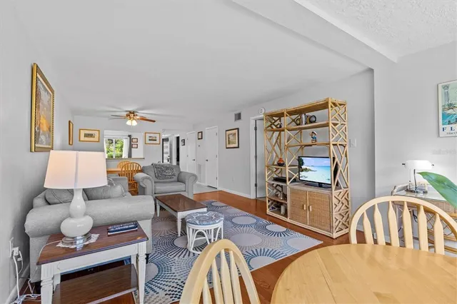 a living room with furniture fireplace and flat screen tv