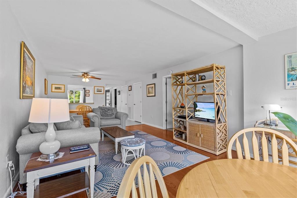 1800 Mariner Drive, Unit 9 Tarpon Springs, FL 34689 - Photo 16 of 41 a living room with furniture fireplace and flat screen tv