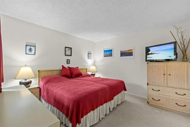 a bedroom with a bed and lamp