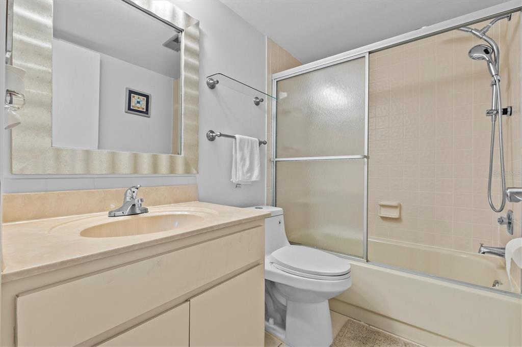 1800 Mariner Drive, Unit 9 Tarpon Springs, FL 34689 - Photo 27 of 41 a bathroom with a sink a toilet and shower